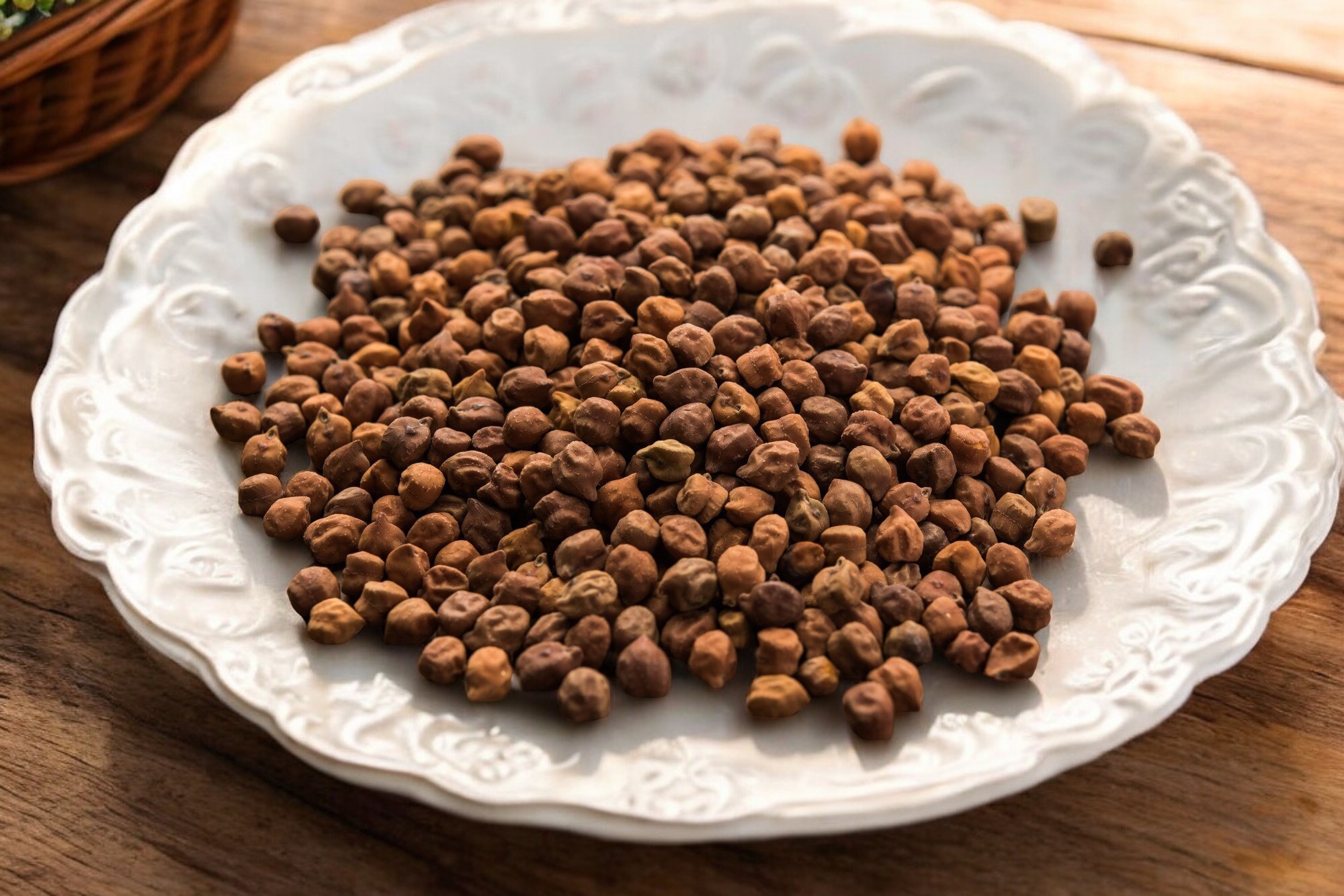 Close-up of raw Kala Chana (black chickpeas), showcasing their small, dark brown color and round shape, perfect for hearty curries and salads.